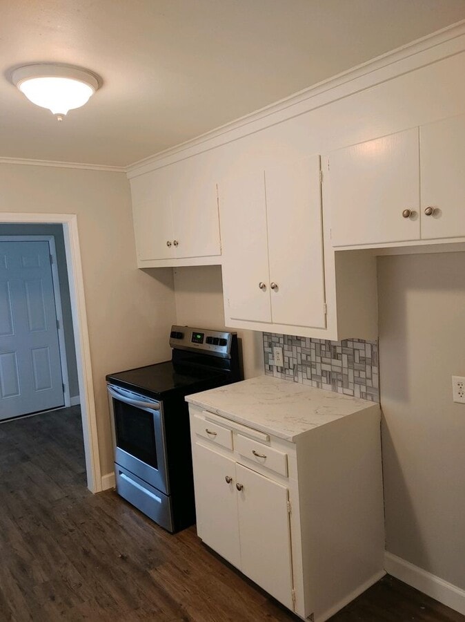 Photo - Corner lot w/mature trees, gorgeous hardwoods, small bonus room off kitchen-perfect for an office.