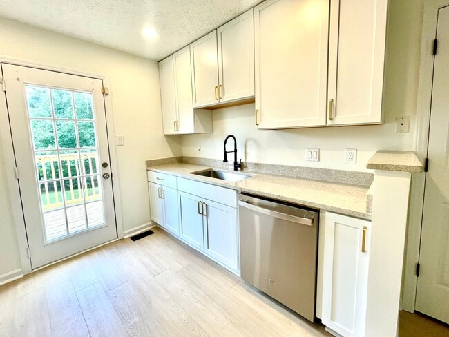 Photo - Beautifully updated, multi-level condo in ...