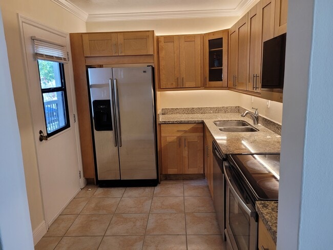 Kitchen with secondary entrance - 20400 W Country Club Dr Unit 115