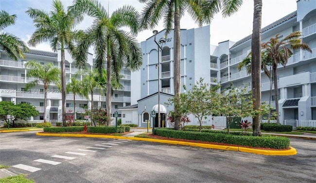 Building Photo - 10700 NW 66th St Unit 204