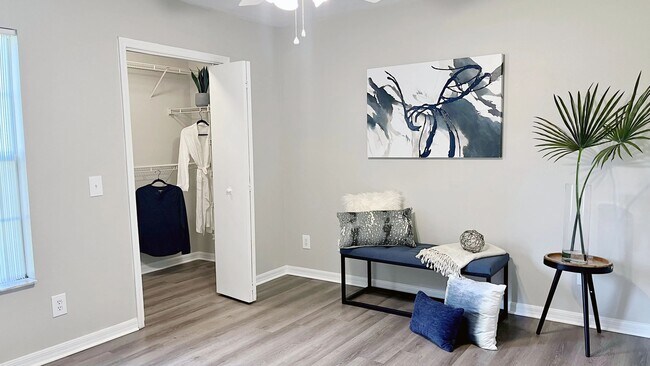 Featuring modern wood-style flooring and a generous walk-in closet, this inviting bedroom offers the perfect blend of style, functionality, and everyday convenience.