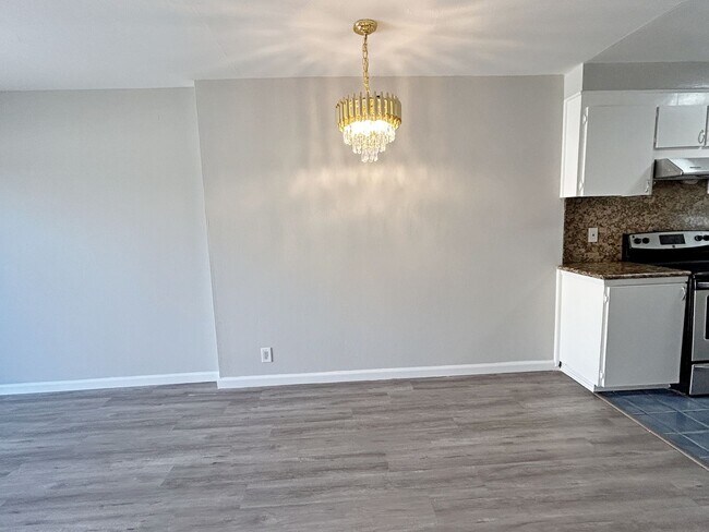 Photo - Move-in ready Evergreen townhome with private backyard, detached 2-car garage, and great communit...