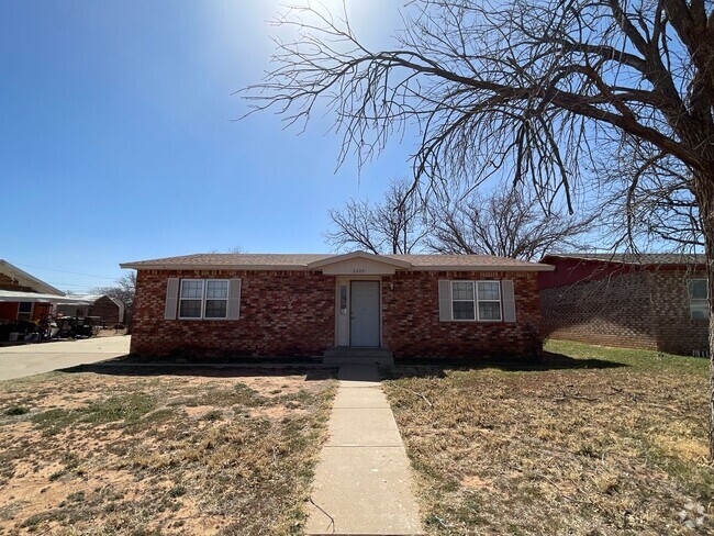 Building Photo - Three bedroom two bath house available in ...