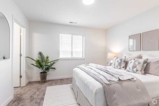 Dormitorio principal 3BR, 2,5 baños y 1464SF - Terra Lofts Apartments & Townhomes