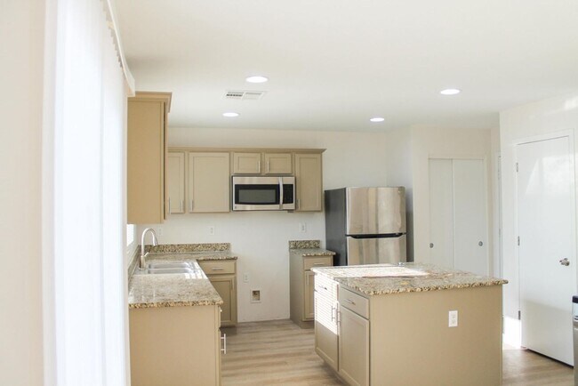 Photo - Gorgeous 4Bed/2.5Bath/2Car home located in North Las Vegas Raven Hill gated community!
