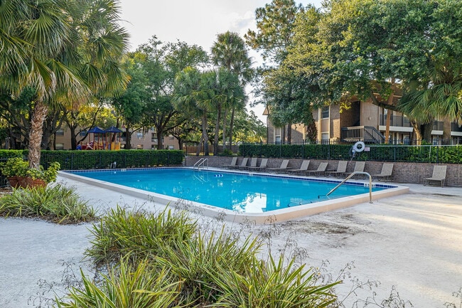 Relax by the pool in this serene, beautifully landscaped apartment community.