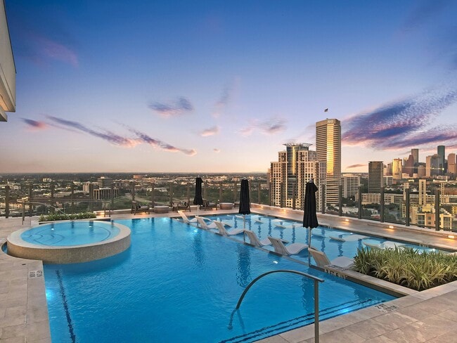 Rooftop pool offering impressive downton views - Hanover Autry Park Apartments