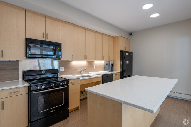 Townhome: Community House Kitchen - Grace West II Apartments