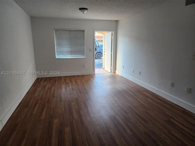 Building Photo - 10019 W Okeechobee Rd Unit 102