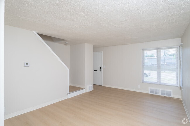 2BR, 1BA - 815SF - Living Room - Amherst Townhomes
