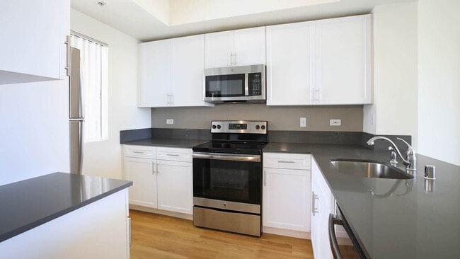 Kitchen with Stainless Steel Appliances and Quartz Countertops