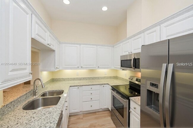 Building Photo - 1301 N Tamiami Trl Unit 0