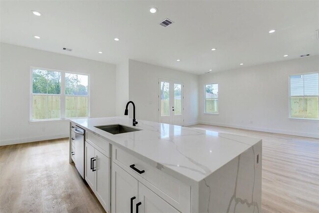 Photo - "Charming 3-Bed Oasis with 2.5 Baths & 1,707 Sq Ft in Houston's Heart!"