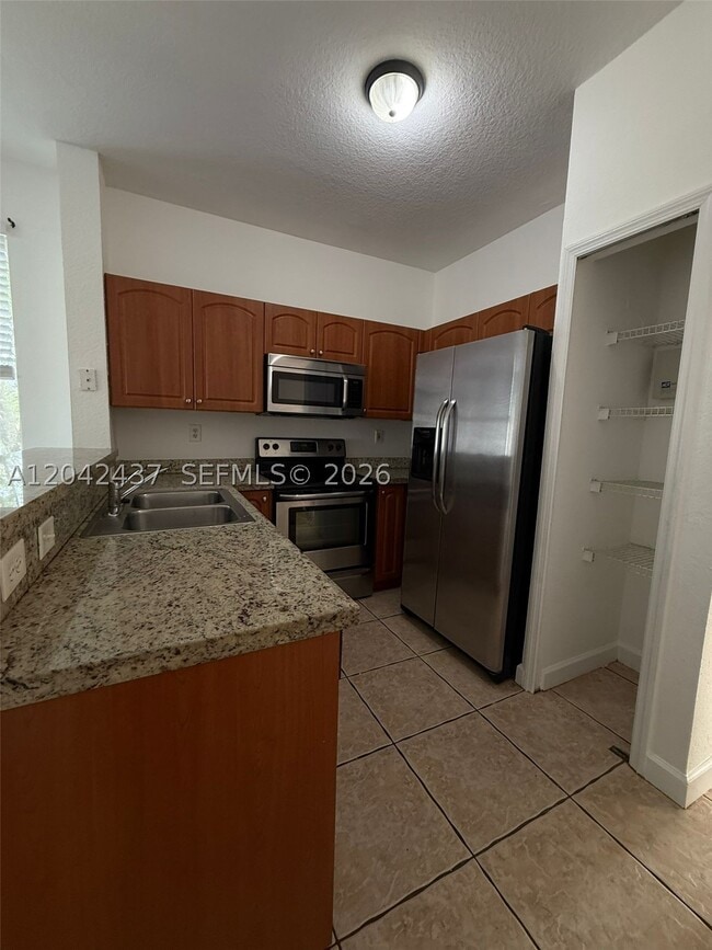Building Photo - 17640 NW 73rd Ave Unit 200-19
