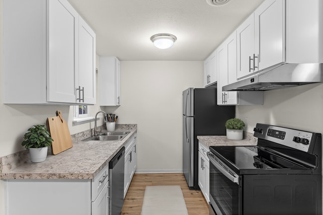 Experience culinary bliss in this stylishly designed kitchen with top-tier finishes. - Monte Vista Apartments