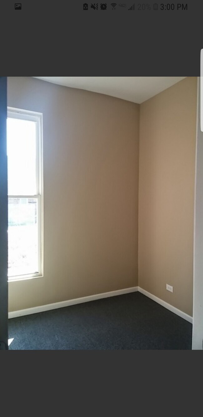 Clean first bedroom. View 2. A queen bed fits well. - 2115 S Central Park Ave Unit 2