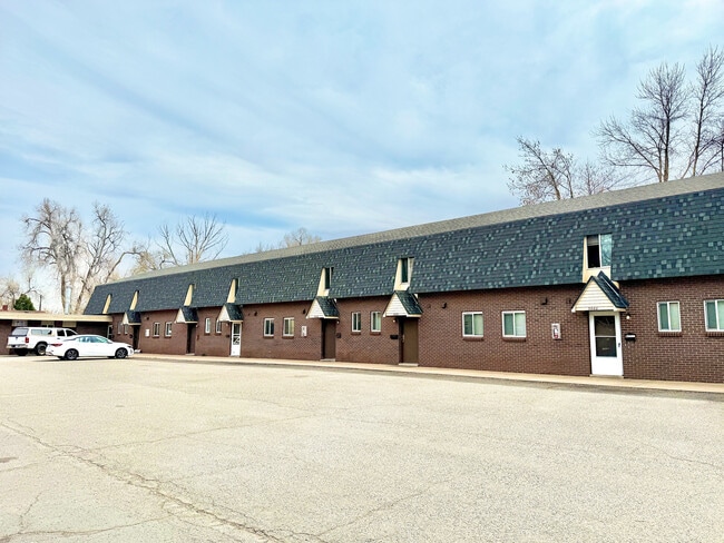 Charming apartment building with unique architecture, ample parking, and a serene neighborhood setting. - 3650 Upham