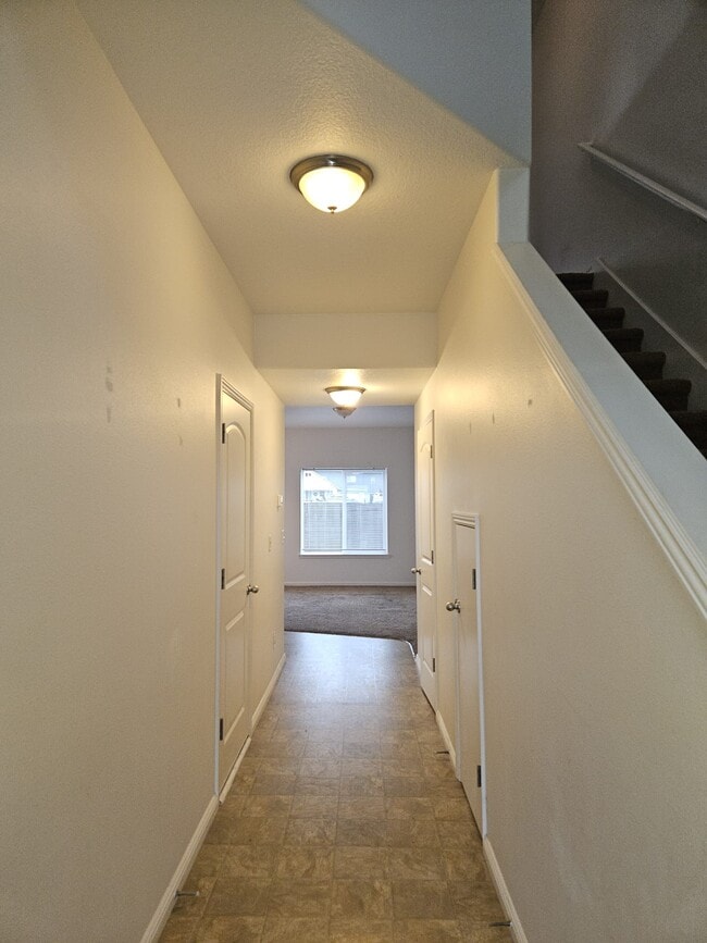 Entry hall, view to stairs to right and into living room - 528 Fenton Ave