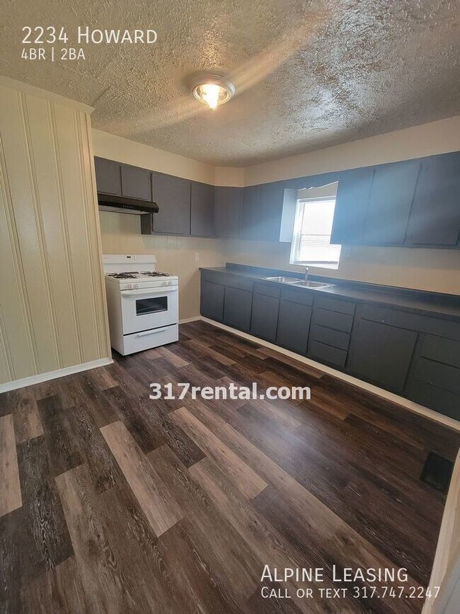 Photo - 4/2 with garage/workshop combo (has workin...