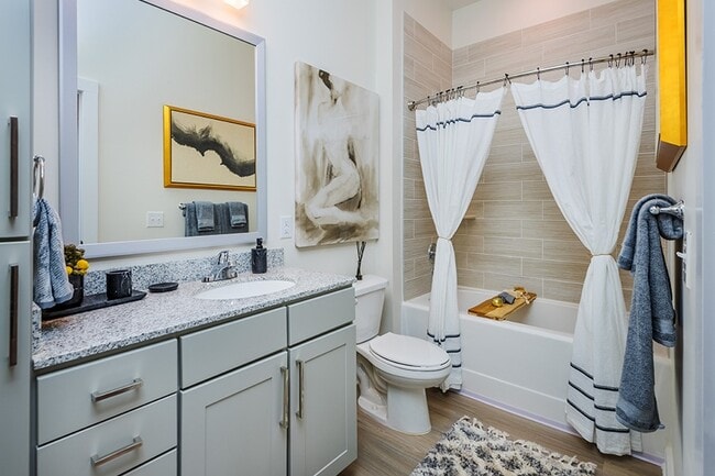 Modern bathrooms include framed mirrors, garden soaking tubs and double vanities in select homes