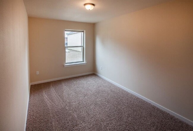 Main floor bedroom 1. - 1220 W Bismark Ave