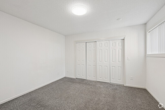 3BR, 2BA - 1,100SF - Primary Bedroom - Tall Oaks Apartments