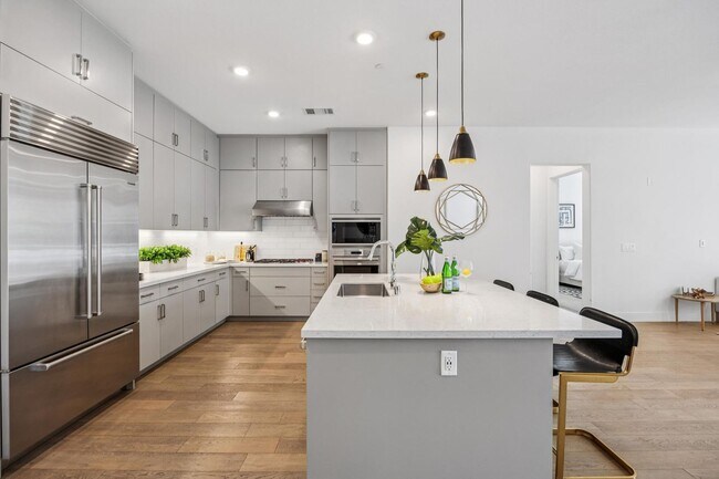 Photo - Luxury Single-Level Corner Residence with Wolf Kitchen & Private Garage Unit 208A