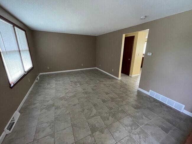 Living room - 1289 East and West Rd Apartments Unit Left Side
