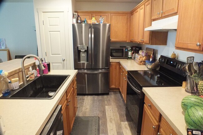 Photo - Spacious End-Unit 3-Bedroom Townhouse with 2-Car Garage & Central AC