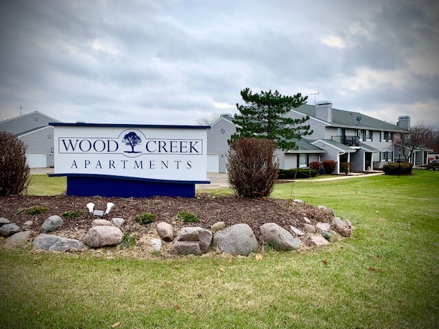 New siding-new signage - Wood Creek Apartments