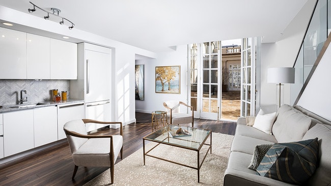 Open concept living areas and kitchens with fully-appointed appliances