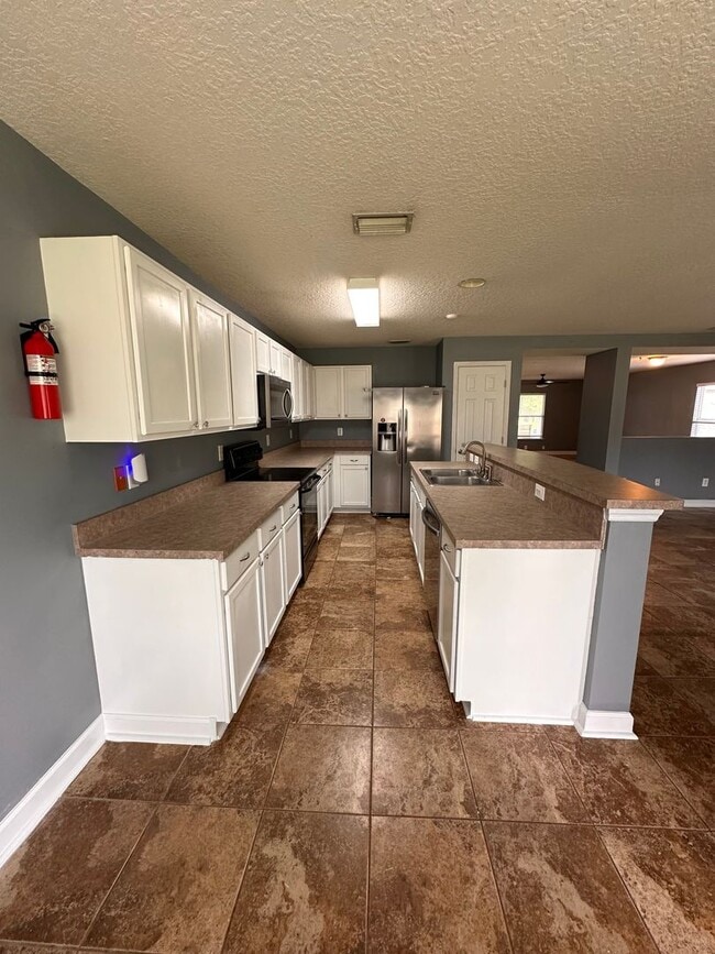 Photo - Charming 3-Bedroom Home with Fenced Yard