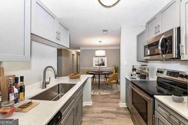 Building Photo - 9200 Roberts Dr Unit 3-312