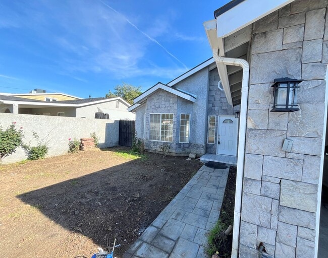 Building Photo - Reseda 4+3 w/fireplace, vaulted ceilings, new flooring, solar panels, + pool! (7522 Balcom Ave)