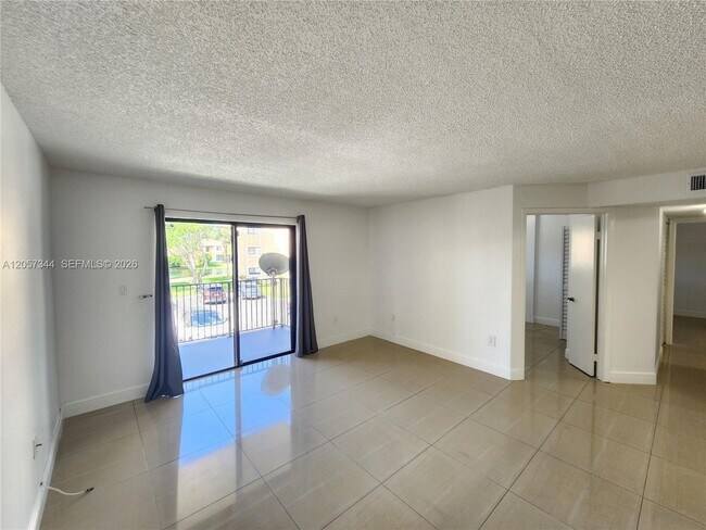 Photo - 9491 Palm Cir S Unit 205