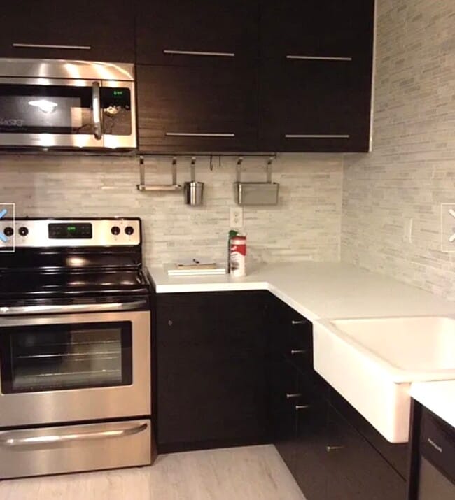 Kitchen w/warm lights on - 77 Atterbury Blvd Unit 114
