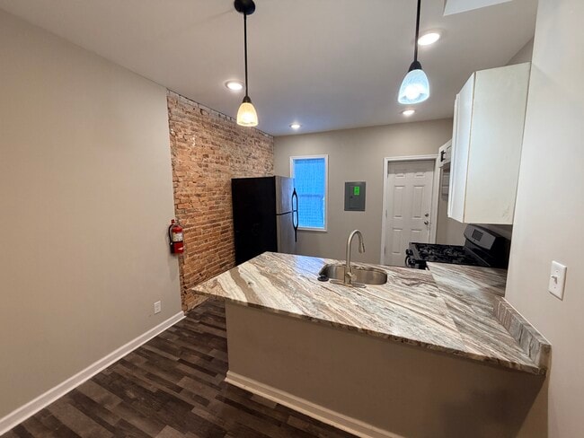 Kitchen & Exposed Brick Accent Wall - 4654 York Rd Unit 2