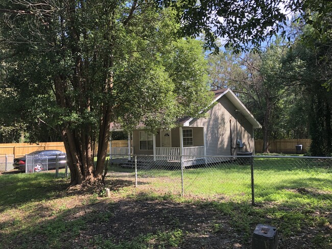 External view with Driveway & fenced yard - 950 E Avenue H House