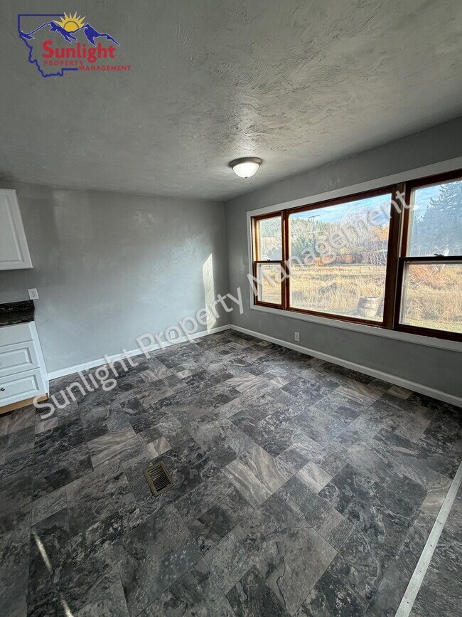 Photo - Spacious 5-Bedroom Home with Open Layout, Off-Street Parking & Large Backyard