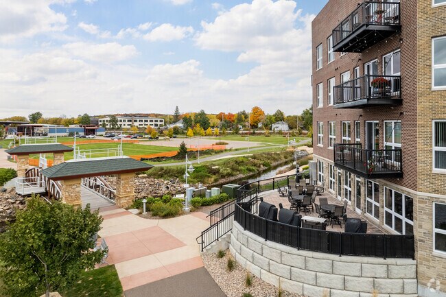 Outdoor Patio and Riverwalk - The Apartments at Riverlife