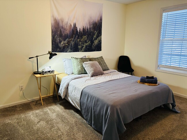 Spacious bedroom with comfortable full-sized bed. - 105 Lincoln Place Cir Apartments Unit Upstairs