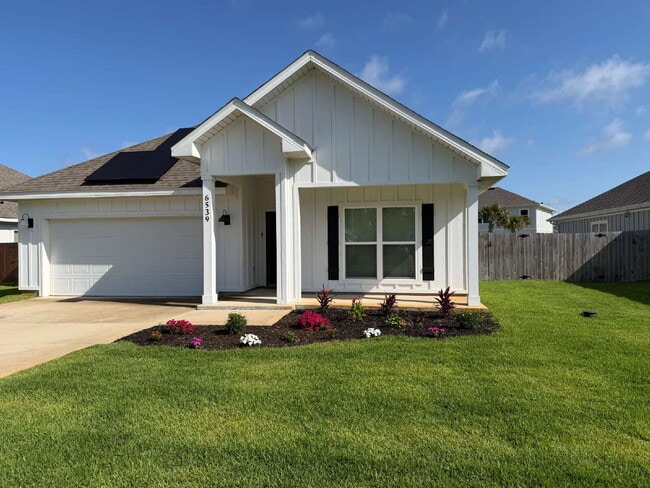 Building Photo - "Charming 4-Bed Oasis with Granite Touches in Gulf Breeze – Electric Included!"