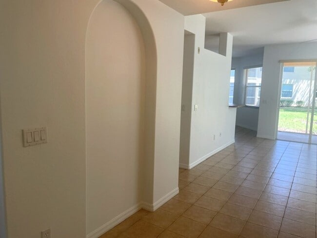 Photo - Elegant 3 Bedroom End-Unit Condo with Screened Lanai & Pond Views and A Private Garage
