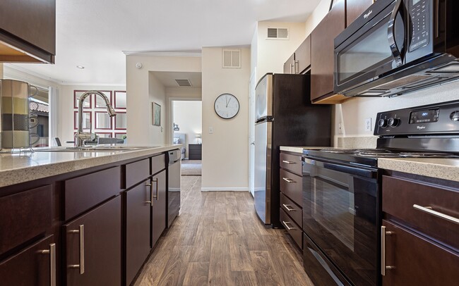 A second finish package keeps the dark cabinets and swaps in black appliances.