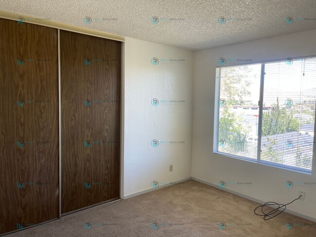 Photo - This delightful 2-bedroom, 1-bathroom condo perched upstairs offers an irresistible opportunity y...