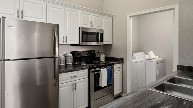 Designed for those who appreciate modern living, our Premium Kitchens showcase updated finishes, stainless steel appliances, and timeless details that create the perfect space for cooking, entertaining, and gathering. - Riverwood Apartments