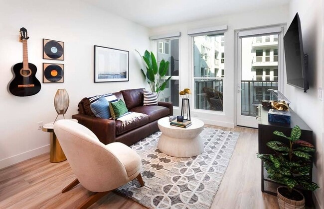 Oversized windows allow plentiful natural light while some homes include private balconies.*