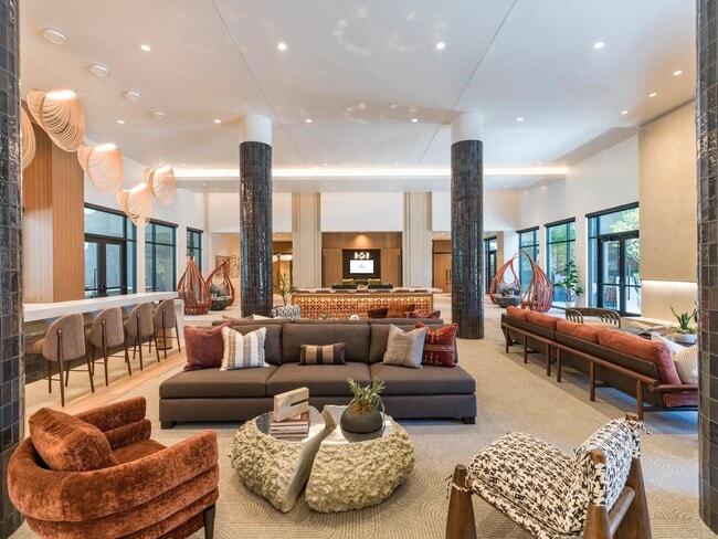 Sophisticated resident lounge featuring designer lighting, eclectic seating, and refined spaces to work, relax, or connect.
