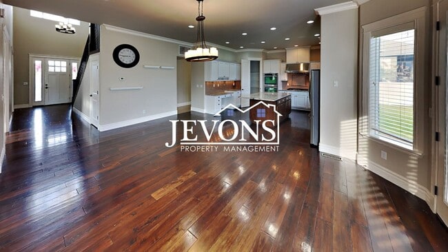 Photo - $1,000 Rent Credit - Spacious home with fully equipped kitchen, private backyard, 3-car garage, a...