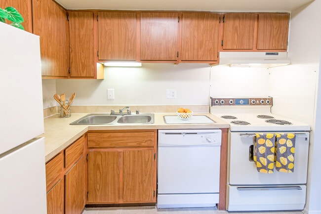 Kitchen (cabinets & appliances may vary) - Manchester West Apartments